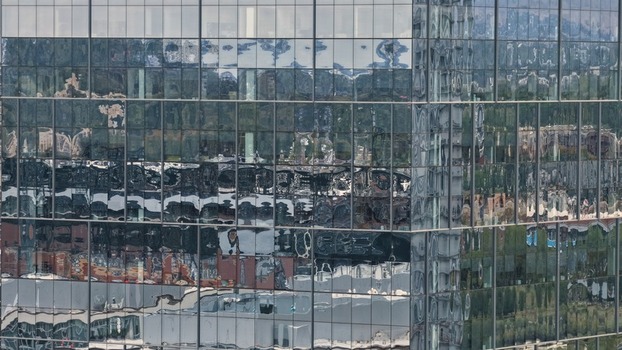 Aerial view of the reflective glass facade of a modern skyscraper in Denver Colorado United States. Aerial view of the reflective glass facade of a modern skyscraper in Denver Colorado United States.