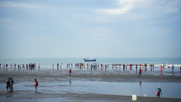 View of people on the beach at Cox s Bazar Bangladesh.