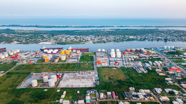 Aerial view of the industrial oil storage facility and harbor in Satellite Town Lagos Lagos Nigeria.