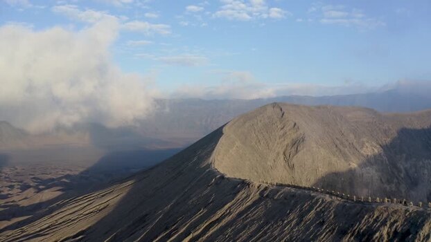 Aerial view of Mount Bromo crater ridge and volcanic slopes Indonesia. Aerial view of Mount Bromo crater ridge and volcanic slopes Indonesia.