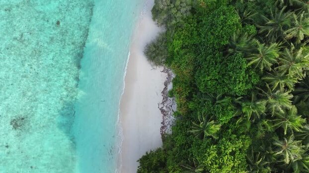 Aerial view of the white sand beach and turquoise lagoon of Maalhos Maldives. Aerial view of the white sand beach and turquoise lagoon of Maalhos Maldives.