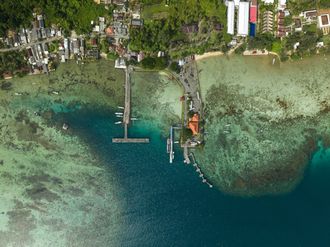 Aerial view of the vibrant Karimunjawa ferry harbour where the emerald waters meet the verdant coastline Karimunjawa Jawa Tengah Indonesia. Aerial view of the vibrant Karimunjawa ferry harbour where the emerald waters meet the verdant coastline Karimunjawa Jawa Tengah Indonesia.