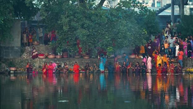 View of people performing a religious ritual in water Bangladesh. View of people performing a religious ritual in water Bangladesh.