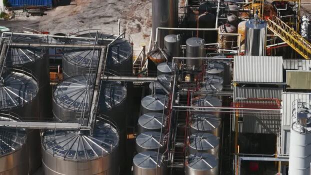 Aerial view of industrial storage tanks and piping Italy.
