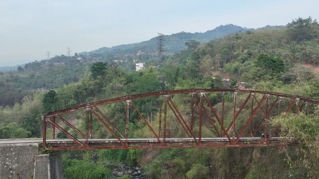 Aerial view of a rusty steel bridge in Soreang Indonesia. Aerial view of a rusty steel bridge in Soreang Indonesia.