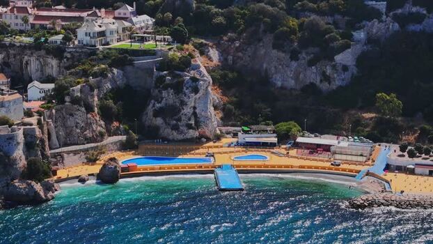 Aerial view of Rosia Bay and coastal swimming pools in Gibraltar.