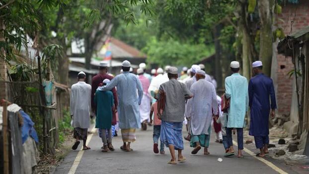 View of men walking to prayer in a village in Bogura Bangladesh. View of men walking to prayer in a village in Bogura Bangladesh.