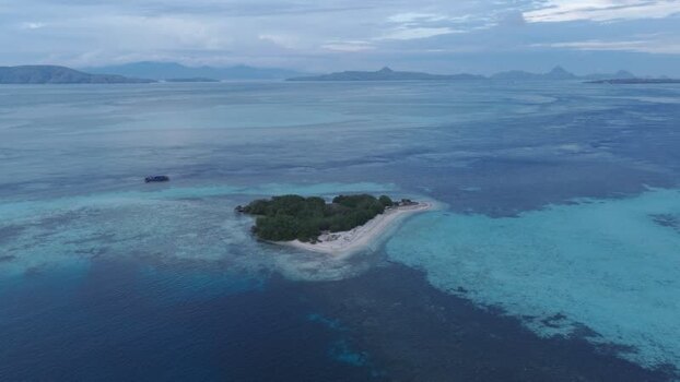 Aerial view of Komodo Island in the turquoise waters of Indonesia.