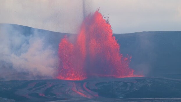 View of a volcanic eruption with glowing lava United States.