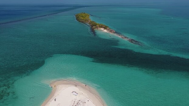 Aerial view of a tropical sandbank and turquoise lagoon Maldives.