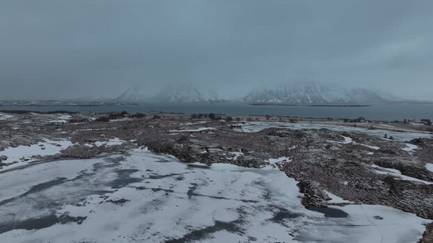 Aerial view of Lofoten mountains and snowy terrain Norway.
