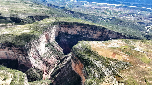 Aerial view of El Vergel canyon with steep rock walls lush vegetation and rugged terrain Torotoro Potosi Department Bolivia. Aerial view of El Vergel canyon with steep rock walls lush vegetation and rugged terrain Torotoro Potosi Department Bolivia.
