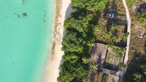 Aerial view of tropical beach and turquoise waters in Fulhadhoo Maldives. Aerial view of tropical beach and turquoise waters in Fulhadhoo Maldives.