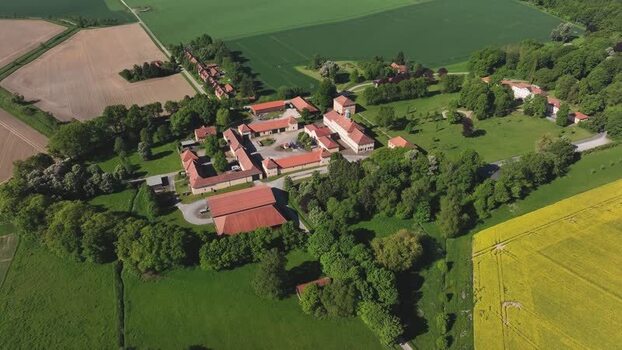 Aerial view of a historic estate and lush green fields Germany. Aerial view of a historic estate and lush green fields Germany.