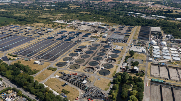 Aerial view of the Severn Trent Water Minworth wastewater treatment plant with circular sedimentation tanks and rectangular basins in Birmingham England United Kingdom. Aerial view of the Severn Trent Water Minworth wastewater treatment plant with circular sedimentation tanks and rectangular basins in Birmingham England United Kingdom.