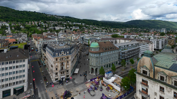 Aerial view of historic architecture and city streets with a green domed building under a cloudy sky in Biel Bienne Canton of Bern Switzerland. Aerial view of historic architecture and city streets with a green domed building under a cloudy sky in Biel Bienne Canton of Bern Switzerland.