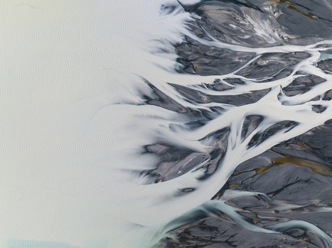 Aerial view of braided rivers intertwine like delicate silver threads across a canvas of rugged earth Lake Tekapo Canterbury Region New Zealand. Aerial view of braided rivers intertwine like delicate silver threads across a canvas of rugged earth Lake Tekapo Canterbury Region New Zealand.