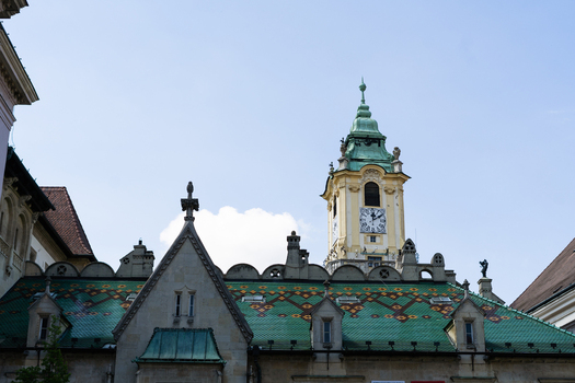 View of the Old Town Hall featuring its ornate clock tower and colorful patterned tiled roof under a clear sky in Bratislava Bratislava Region Slovakia. View of the Old Town Hall featuring its ornate clock tower and colorful patterned tiled roof under a clear sky in Bratislava Bratislava Region Slovakia.