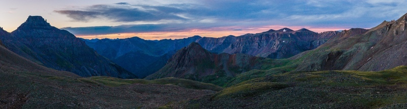 Aerial view of Mount Sneffels and rugged peaks of San Juan Mountains in Rocky Mountains at sunrise with dramatic light over alpine landscape in Ouray County Colorado United States. Aerial view of Mount Sneffels and rugged peaks of San Juan Mountains in Rocky Mountains at sunrise with dramatic light over alpine landscape in Ouray County Colorado United States.