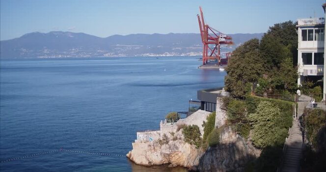 View of the Rijeka coastline with a port crane Croatia.