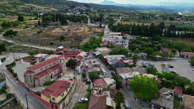 Aerial view of a town with a church and ancient ruins Greece.