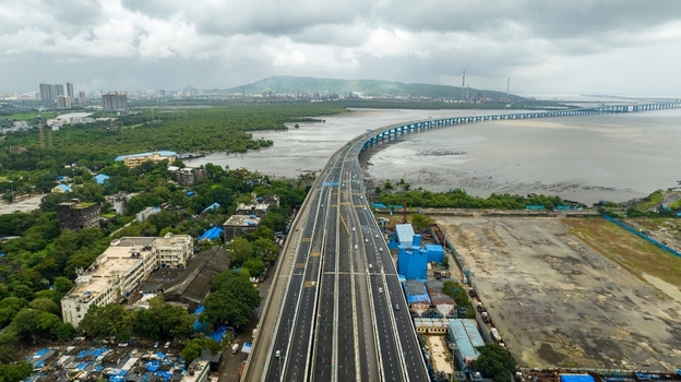 Aerial view of the Atal Bihari Vajpayee Sewri Nhava Sheva Atal Setu bridge stretching across the bay with surrounding urban landscape and coastal greenery in Mumbai Maharashtra India. Aerial view of the Atal Bihari Vajpayee Sewri Nhava Sheva Atal Setu bridge stretching across the bay with surrounding urban landscape and coastal greenery in Mumbai Maharashtra India.