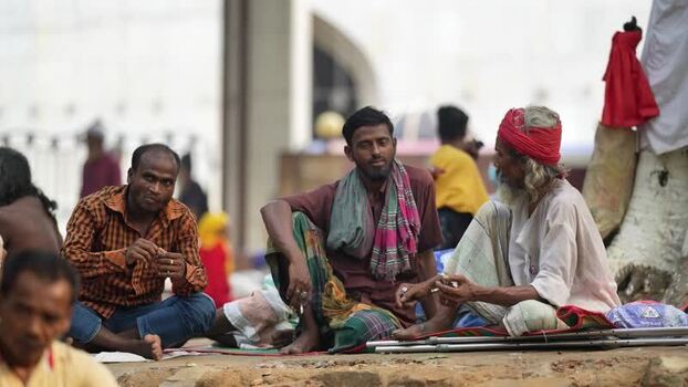 View of men sitting and talking at Mahasthan in Bogura Bangladesh.