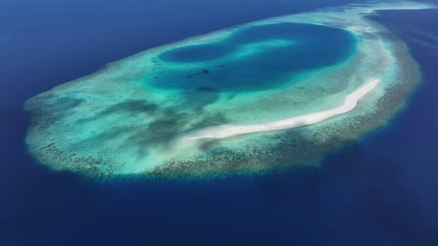 Aerial view of a coral atoll and sandbar in Kendhoo Maldives. Aerial view of a coral atoll and sandbar in Kendhoo Maldives.
