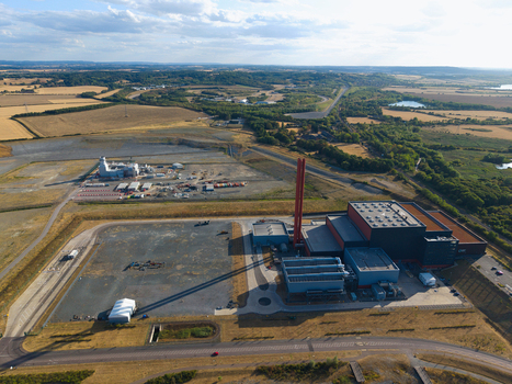 Aerial view of the Rookery South ERF and Millbrook power plant complex with its large chimneys and industrial buildings surrounded by open fields and roads in Stewartby England United Kingdom.