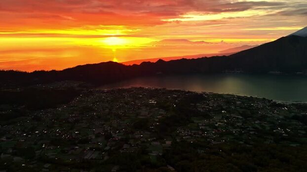 Aerial view of Mount Batur and Lake Batur at sunrise Indonesia.