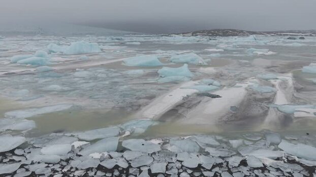 Aerial view of icebergs floating in Fjallsarlon lagoon Iceland. Aerial view of icebergs floating in Fjallsarlon lagoon Iceland.