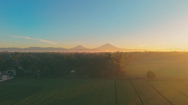 Aerial view of rice fields and mountains at sunrise Indonesia. Aerial view of rice fields and mountains at sunrise Indonesia.