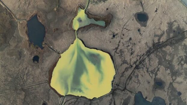 Aerial view of a yellow mineral lake in a volcanic landscape Iceland. Aerial view of a yellow mineral lake in a volcanic landscape Iceland.