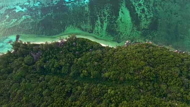 Aerial view of a lush tropical coastline Seychelles.