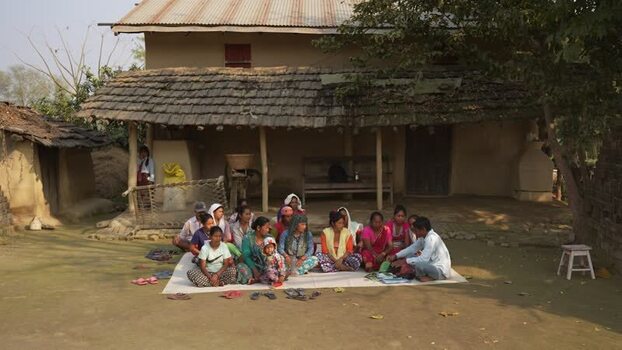 View of a community meeting in a rural village Nepal. View of a community meeting in a rural village Nepal.
