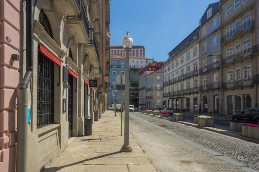 Porto Portugal 13 July 2021 View of a charming Porto street where historic buildings rise with their colorful facades under a bright clear sky. Porto Portugal 13 July 2021 View of a charming Porto street where historic buildings rise with their colorful facades under a bright clear sky.