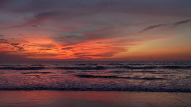 View of sunset over the waves at Cox s Bazar beach Bangladesh. View of sunset over the waves at Cox s Bazar beach Bangladesh.