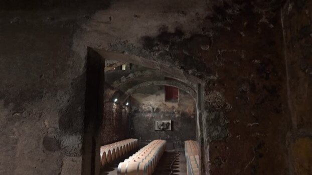 View of wine barrels in Chateau du Taillan cellar France.