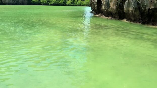 View of lush green karsts and emerald waters Thailand.