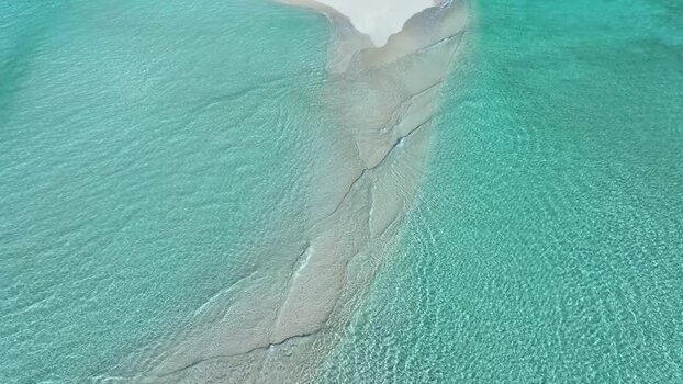 Aerial view of a pristine sandbank in turquoise waters Maldives. Aerial view of a pristine sandbank in turquoise waters Maldives.