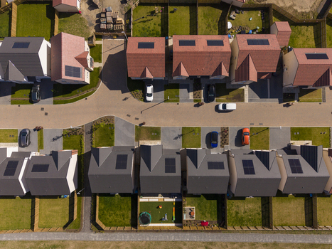 Linlithgow United Kingdom 29 April 2026 Aerial view of modern residential houses with solar panels on rooftops parked cars on a suburban street and green gardens. Linlithgow United Kingdom 29 April 2026 Aerial view of modern residential houses with solar panels on rooftops parked cars on a suburban street and green gardens.