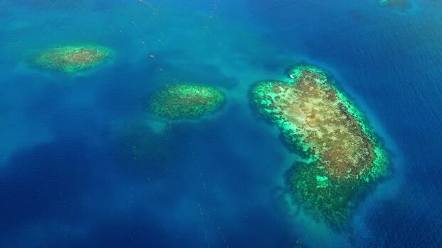 Aerial view of coral reefs and turquoise waters in Guanaja Honduras. Aerial view of coral reefs and turquoise waters in Guanaja Honduras.