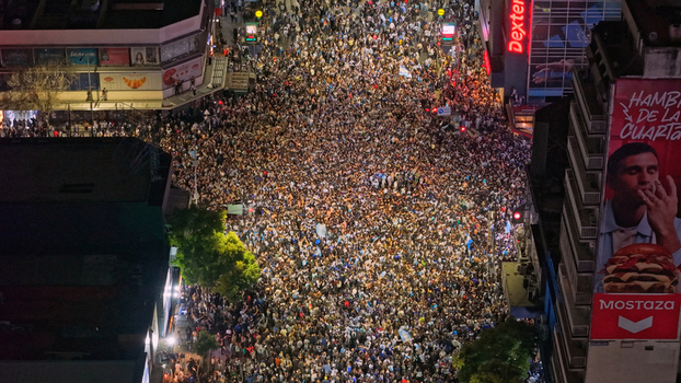 Buenos Aires Argentina 15 July 2026 Aerial view of a massive crowd of football fans celebrating at the Cabildo and Juramento intersection in Belgrano at night with city lights. Buenos Aires Argentina 15 July 2026 Aerial view of a massive crowd of football fans celebrating at the Cabildo and Juramento intersection in Belgrano at night with city lights.