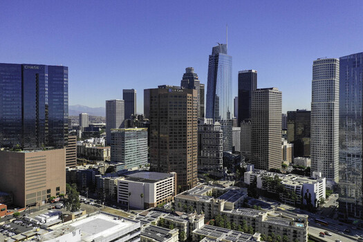 Aerial view of Downtown Los Angeles office buildings and skyscrapers under a clear blue sky in Los Angeles California United States. Aerial view of Downtown Los Angeles office buildings and skyscrapers under a clear blue sky in Los Angeles California United States.