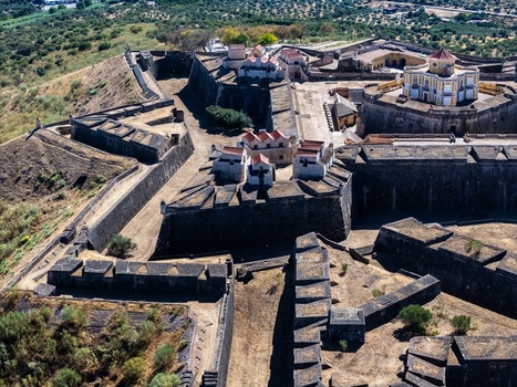 Elvas Portugal 10 September 2026 Aerial view of Forte de Nossa Senhora da Graca showcasing its star shaped stone fortifications and historic buildings in the Alentejo landscape. Elvas Portugal 10 September 2026 Aerial view of Forte de Nossa Senhora da Graca showcasing its star shaped stone fortifications and historic buildings in the Alentejo landscape.