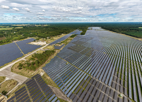 Aerial view of the former Military Airfield Preschen now a solar farm with panels covering the historic runway and taxiway surrounded by forest in Neisse Malxetal Brandenburg Germany. Aerial view of the former Military Airfield Preschen now a solar farm with panels covering the historic runway and taxiway surrounded by forest in Neisse Malxetal Brandenburg Germany.