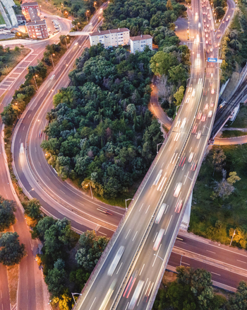 Aerial view of vehicles driving the freeway in Lisbon at sunset Alc&acirc;ntara Lisbon Portugal.