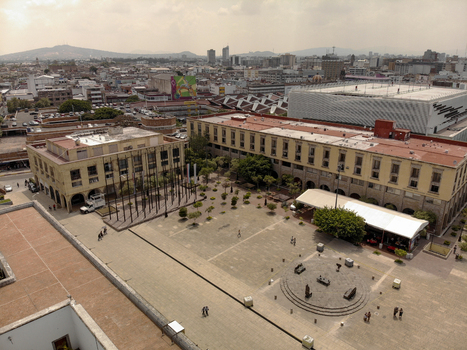 Aerial view of the historic Centro district featuring a large open plaza surrounded by colonial style buildings trees and urban architecture in Guadalajara Jalisco Mexico. Aerial view of the historic Centro district featuring a large open plaza surrounded by colonial style buildings trees and urban architecture in Guadalajara Jalisco Mexico.