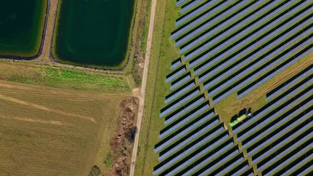 Aerial view of solar panels and ponds United Kingdom.