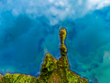 Agua de Alto Portugal 12 May 2025 Aerial view of a lush green peninsula jutting into the deep blue volcanic lake waters under a soft layer of white clouds. Agua de Alto Portugal 12 May 2025 Aerial view of a lush green peninsula jutting into the deep blue volcanic lake waters under a soft layer of white clouds.